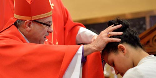 sacrament of confirmation laying on of hands